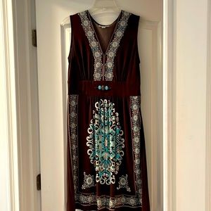 Mid length dress with brown teal and cream print. Worn once